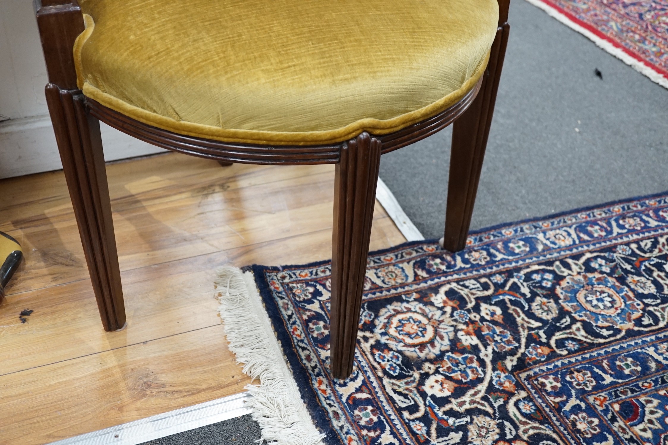 A stylish Art Deco mahogany elbow chair by Trollope and Son, numbered 4088, height 95cm *Please note the sale commences at 9am.